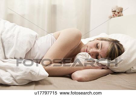 Stock Photography - Young woman sleeping. Fotosearch