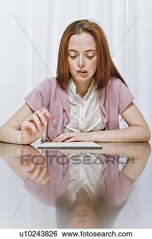Young woman studying View Large Photo Image Stock Photograph - Young woman studying. Fotosearch