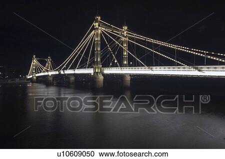 Stock Image - Albert Bridge lit up at night. Fotosearch