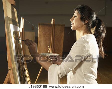 Artist painting in studio View Large Photo Image Stock Photo - Artist painting in studio. Fotosearch