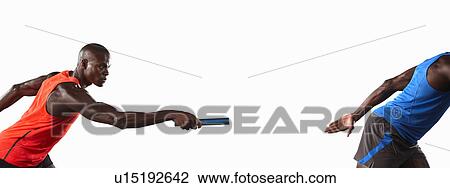 Athlete passing relay baton View Large Photo Image Stock Image - Athlete passing relay baton. Fotosearch