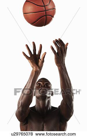 Athlete playing with basketball View Large Photo Image Stock Photo - Athlete playing with basketball . Fotosearch