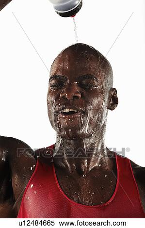 Athlete pouring water over his head View Large Photo Image Stock Photography - Athlete pouring water over his head. Fotosearch