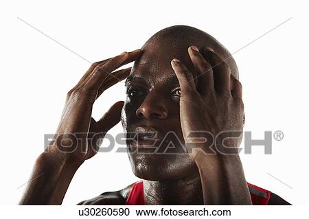 Athlete rubbing his temples View Large Photo Image Stock Image - Athlete rubbing his temples. Fotosearch