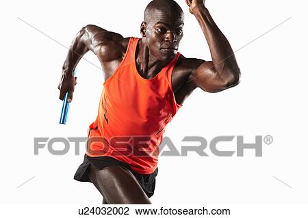 Stock Image - Athlete running with relay baton. Fotosearch