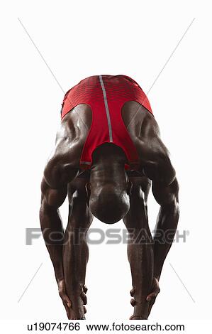 Athlete stretching View Large Photo Image Stock Photograph - Athlete stretching. Fotosearch