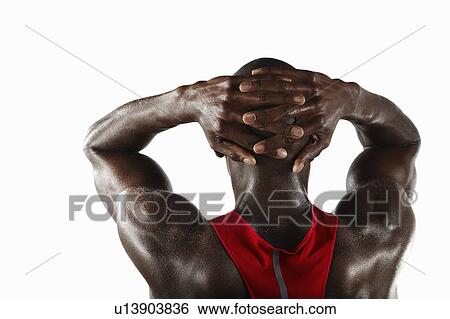 Athlete with hands folded behind head View Large Photo Image Stock Photograph - Athlete with hands folded behind head. Fotosearch
