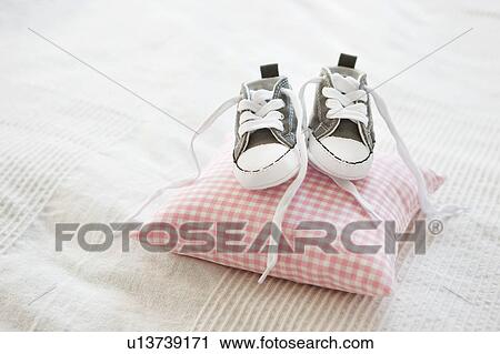 Baby shoes on pillow View Large Photo Image Stock Image - Baby shoes on pillow. Fotosearch