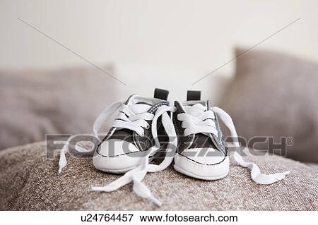 Baby shoes on pillow View Large Photo Image Stock Photo - Baby shoes on pillow. Fotosearch