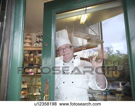Baker opening his cake shop View Large Photo Image Stock Photo - Baker opening his cake shop. Fotosearch