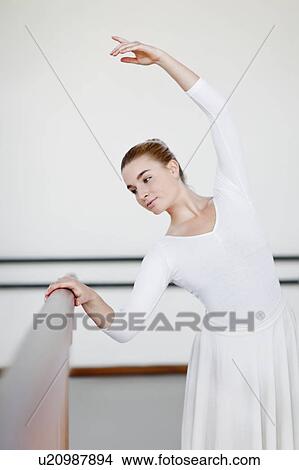Ballet dancer posing at barre View Large Photo Image Picture - Ballet dancer posing at barre. Fotosearch