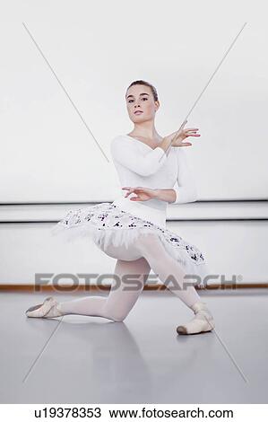 Stock Image - Ballet dancer posing in studio. Fotosearch