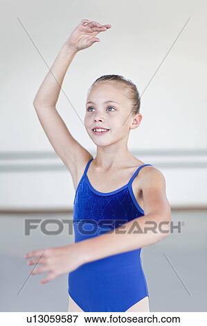 Ballet dancer posing in studio View Large Photo Image Stock Photo - Ballet dancer posing in studio. Fotosearch
