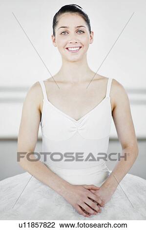 Stock Image - Ballet dancer smiling in studio. Fotosearch