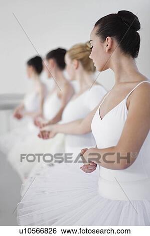 Ballet dancers holding hands in studio View Large Photo Image Stock Photograph - Ballet dancers holding hands in studio. Fotosearch