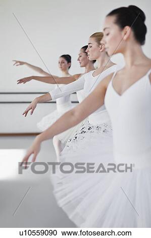 Ballet dancers posing in studio View Large Photo Image Stock Image - Ballet dancers posing in studio. Fotosearch