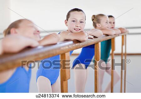 Ballet dancers standing at barre View Large Photo Image Picture - Ballet dancers standing at barre. Fotosearch