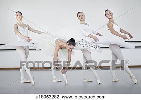 Ballet dancers standing in studio View Large Photo Image Stock Image - Ballet dancers standing in studio. Fotosearch