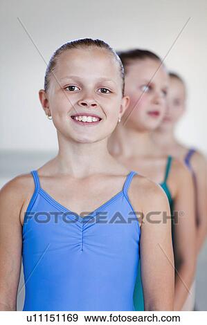 Ballet dancers standing in studio View Large Photo Image Stock Photo - Ballet dancers standing in studio. Fotosearch