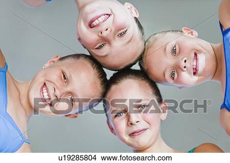 Picture - Ballet dancers with heads together. Fotosearch