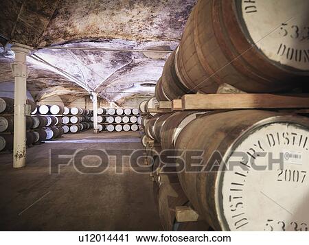 Barrels of whisky aging in distillery View Large Photo Image Stock Image - Barrels of whisky aging in distillery. Fotosearch