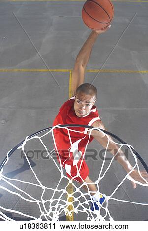 Basketball player about to dunk View Large Photo Image Stock Image - Basketball player about to dunk. Fotosearch