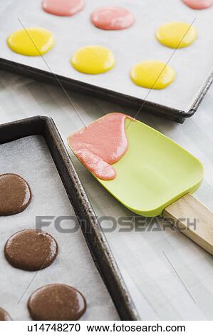 Stock Image - Batter on cookie sheets and spatula. Fotosearch