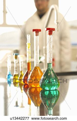 Beakers of liquid in factory View Large Photo Image Stock Photo - Beakers of liquid in factory. Fotosearch