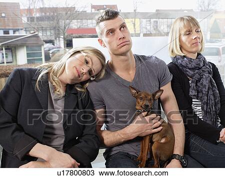 Bored people waiting in line View Large Photo Image Stock Image - Bored people waiting in line. Fotosearch