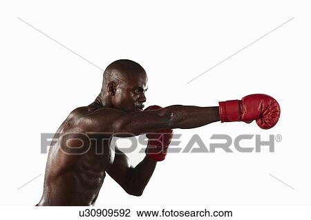 Stock Image - Boxer punching the air. Fotosearch