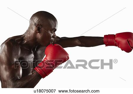 Stock Photo - Boxer punching the air. Fotosearch