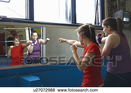 Boxer training with coach in gym View Large Photo Image Stock Photo - Boxer training with coach in gym. Fotosearch