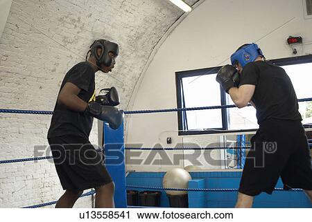 Boxers sparring in ring View Large Photo Image Stock Image - Boxers sparring in ring. Fotosearch