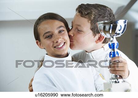 Boy kissing smiling fencing rival View Large Photo Image Stock Image - Boy kissing smiling fencing rival. Fotosearch