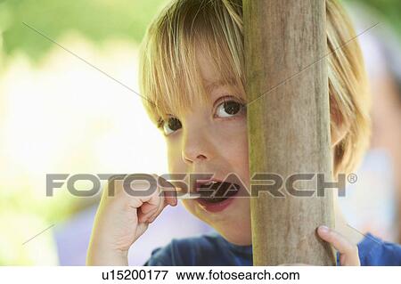Boy sucking on lollipop View Large Photo Image Stock Photo - Boy sucking on lollipop. Fotosearch