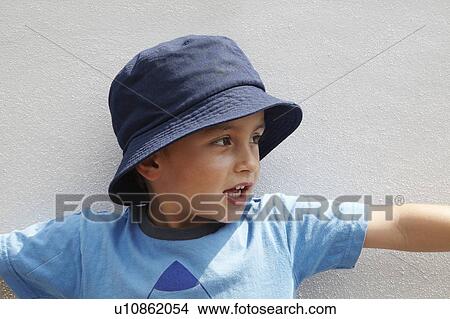 Picture - Boy wearing bucket hat. Fotosearch
