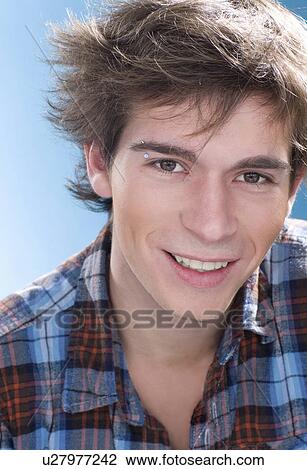 Boy wearing eyebrow piercing View Large Photo Image Stock Image - Boy wearing eyebrow piercing. Fotosearch