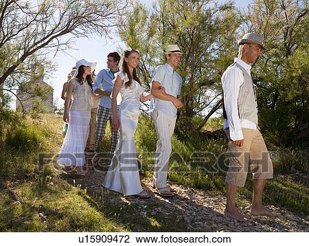 Bridal procession walking on rural path View Large Photo Image Stock Image - Bridal procession walking on rural path. Fotosearch