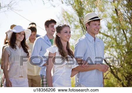 Bridal procession walking on rural path View Large Photo Image Stock Photograph - Bridal procession walking on rural path. Fotosearch