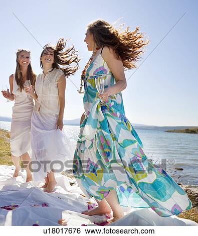 Bride drinking champagne with friends View Large Photo Image Stock Photograph - Bride drinking champagne with friends. Fotosearch