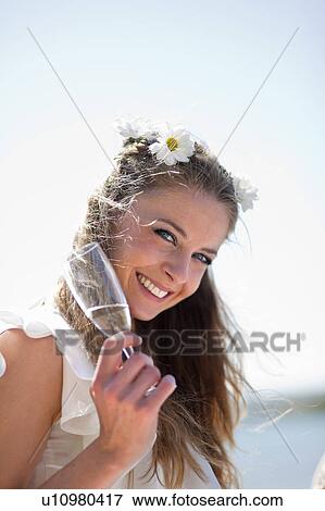 Bride having a glass of champagne View Large Photo Image Stock Photo - Bride having a glass of champagne. Fotosearch