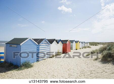 Brightly colored huts on beach View Large Photo Image Stock Photography - Brightly colored huts on beach. Fotosearch