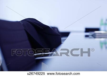 Business jacket on office chair at desk View Large Photo Image Stock Photography - Business jacket on office chair at desk. Fotosearch