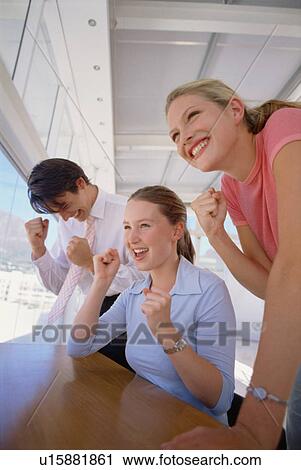Business people cheering together View Large Photo Image Stock Image - Business people cheering together. Fotosearch
