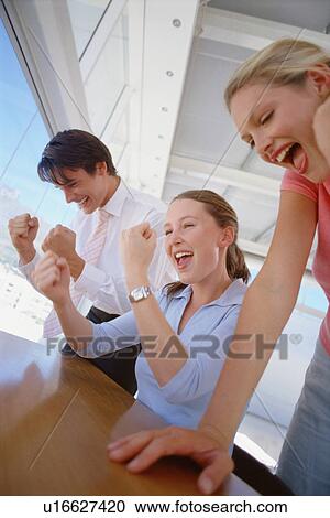 Business people cheering together View Large Photo Image Stock Image - Business people cheering together. Fotosearch