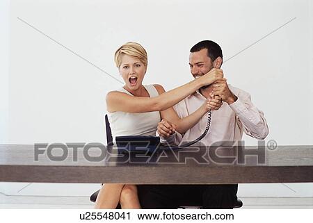 Business people fighting over telephone View Large Photo Image Stock Image - Business people fighting over telephone. Fotosearch