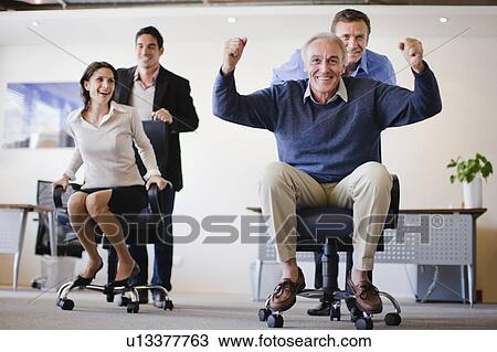Business people having chair race View Large Photo Image Stock Image - Business people having chair race. Fotosearch