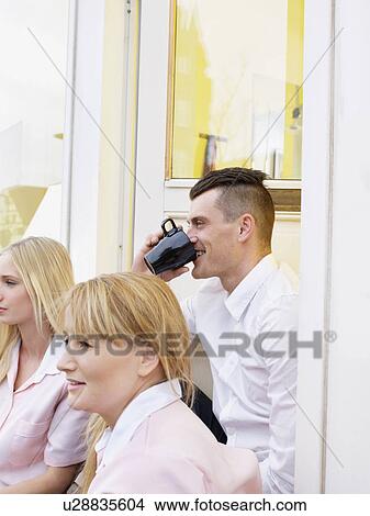 Business people having coffee outdoors View Large Photo Image Picture - Business people having coffee outdoors. Fotosearch
