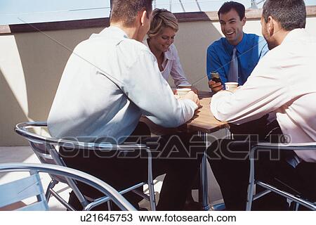 Business people having coffee together View Large Photo Image Stock Image - Business people having coffee together. Fotosearch