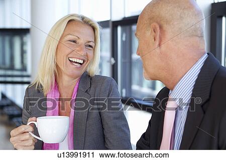 Business people having cup of coffee View Large Photo Image Stock Image - Business people having cup of coffee. Fotosearch